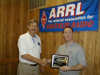 NCJ editor, Carl K9LA presents plaque award to SMC president, Paul K9PG