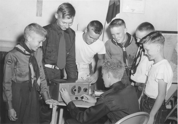 Ken Buser W9YNI operating the ham radio / short wave receiver in 1954.