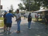 1) KC9ELV and N9QXZ converse with Jerry WB9Z, outside in the fleamarket